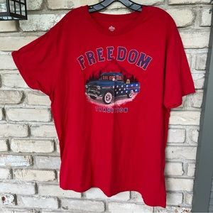 Patriotic celebrate red shirt with pick up truck detailed in stars. Dog in back